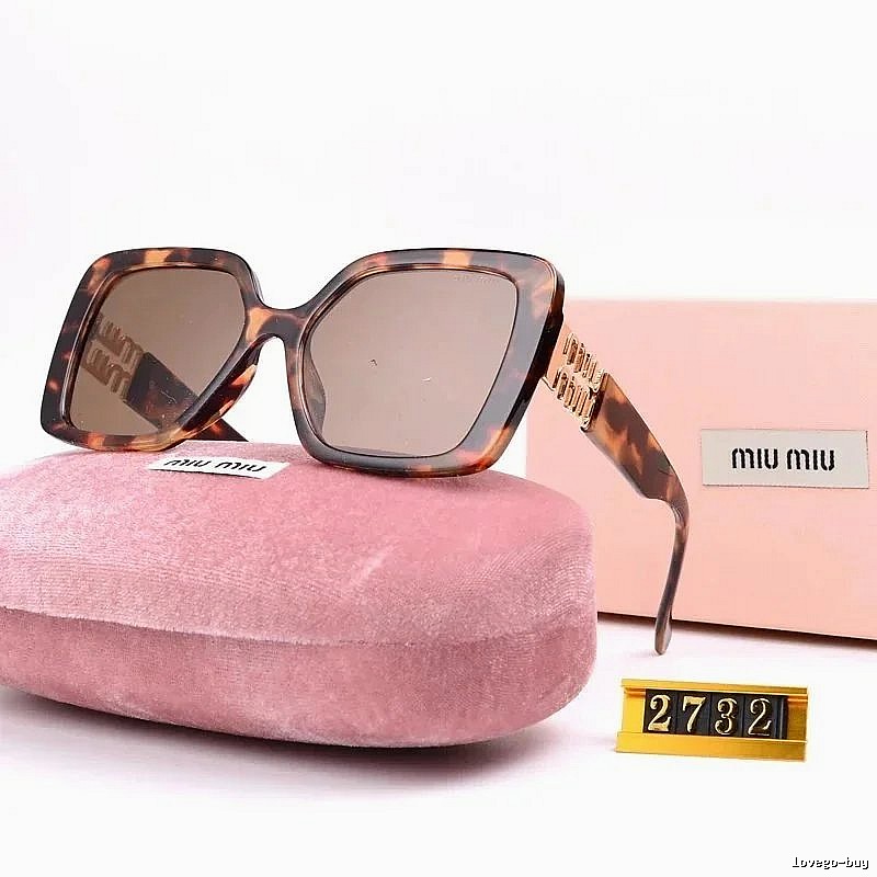 Miu Miu Patterned Oversized sunglasses Black Oval Sunglasses with Polished Detail