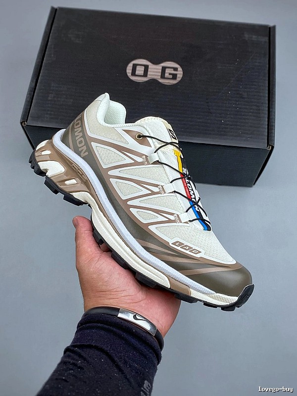 Salomon Tan and Gray Trail Runners Defined by Treaded Trail Sole